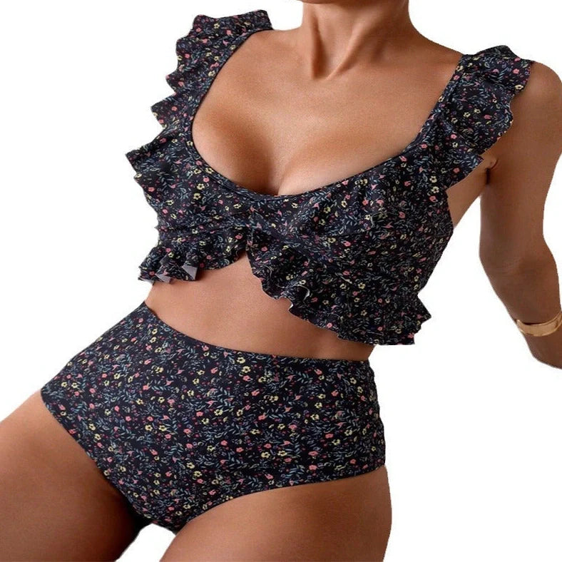 Women's backless floral print split swimsuit with pink, green, blue, purple flowers on black background