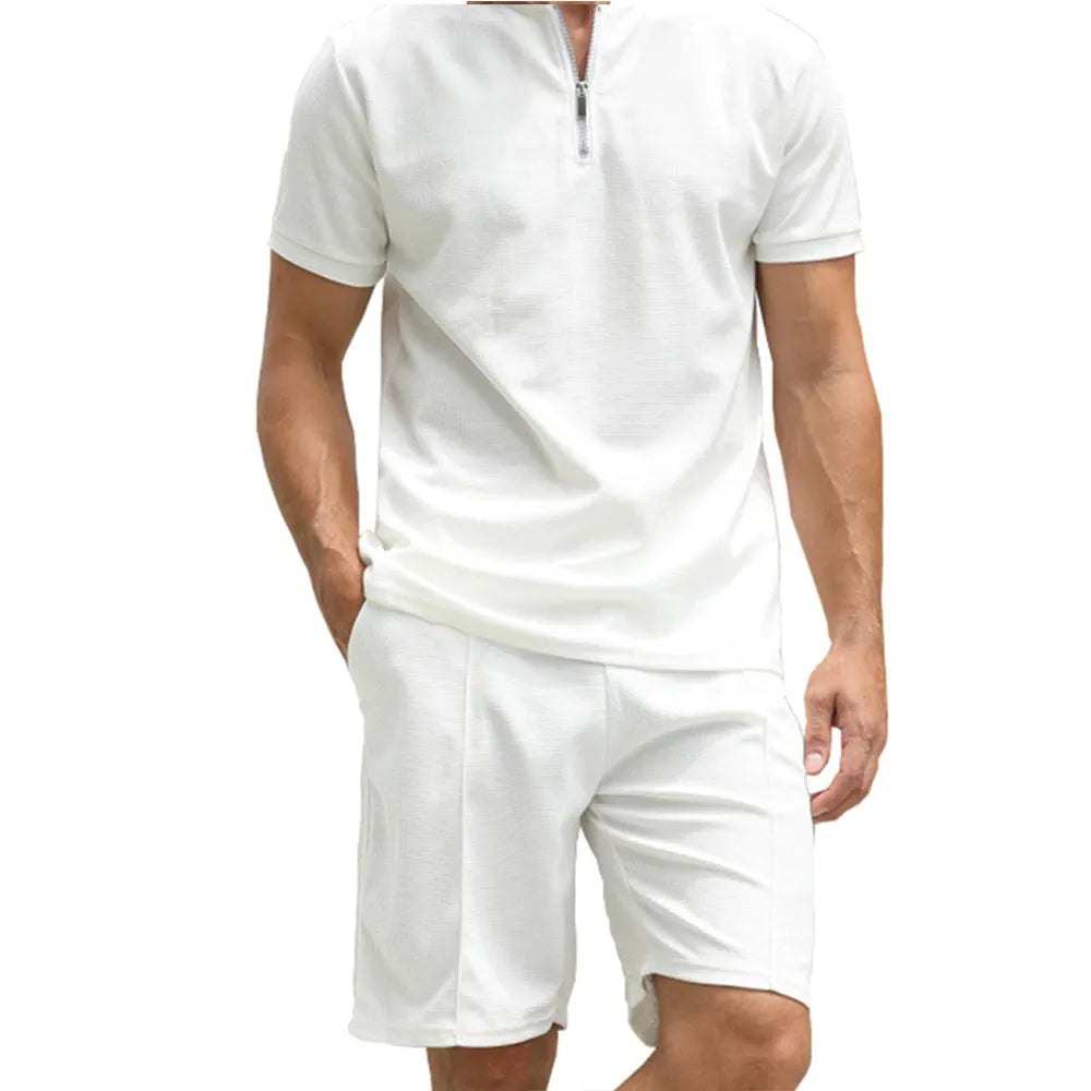Men's solid colour polo shirt and trousers two-piece casual suit set on a hanger.