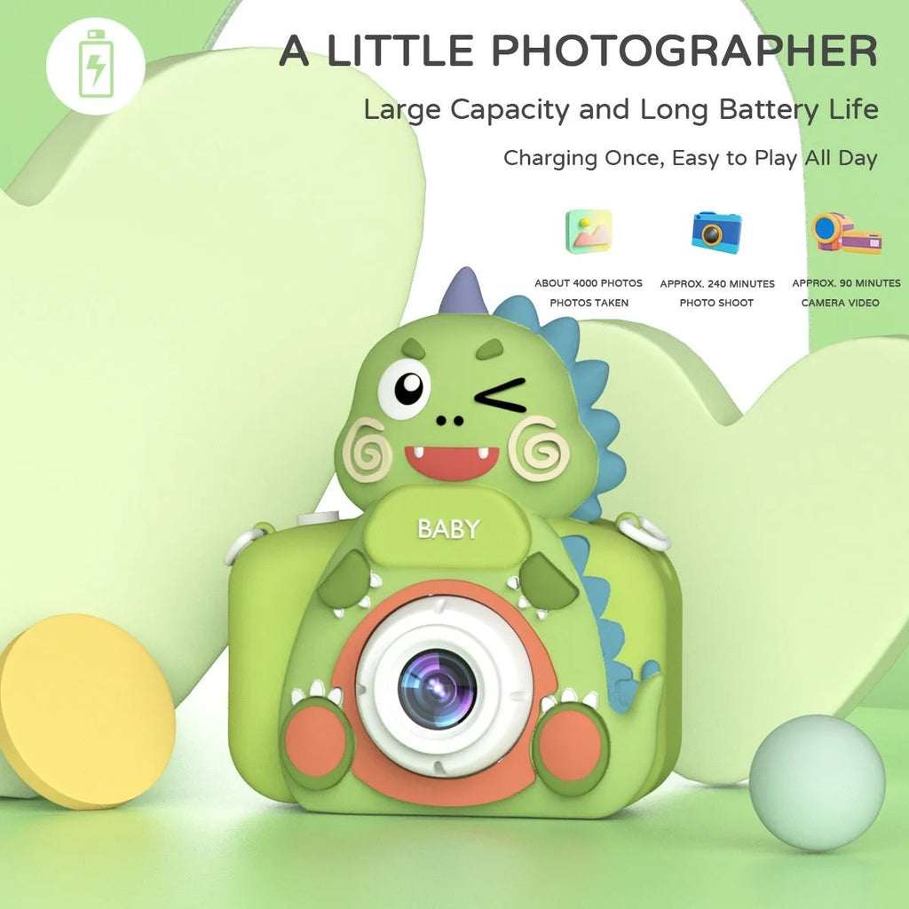 Children's mini cartoon camera with silicone body, Big Head Dinosaur colour, with lanyard and charging cable on white background