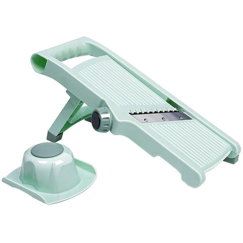 Adjustable vegetable slicer with stainless steel blade in mint green