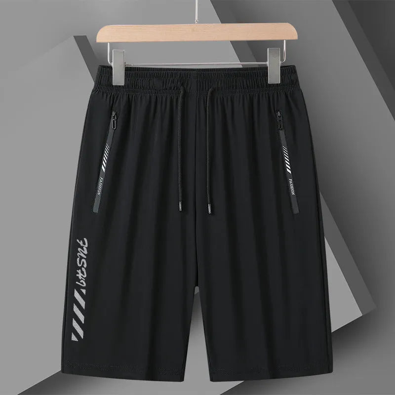 Men's quick-drying nylon sports shorts in loose fit with fifth pants length
