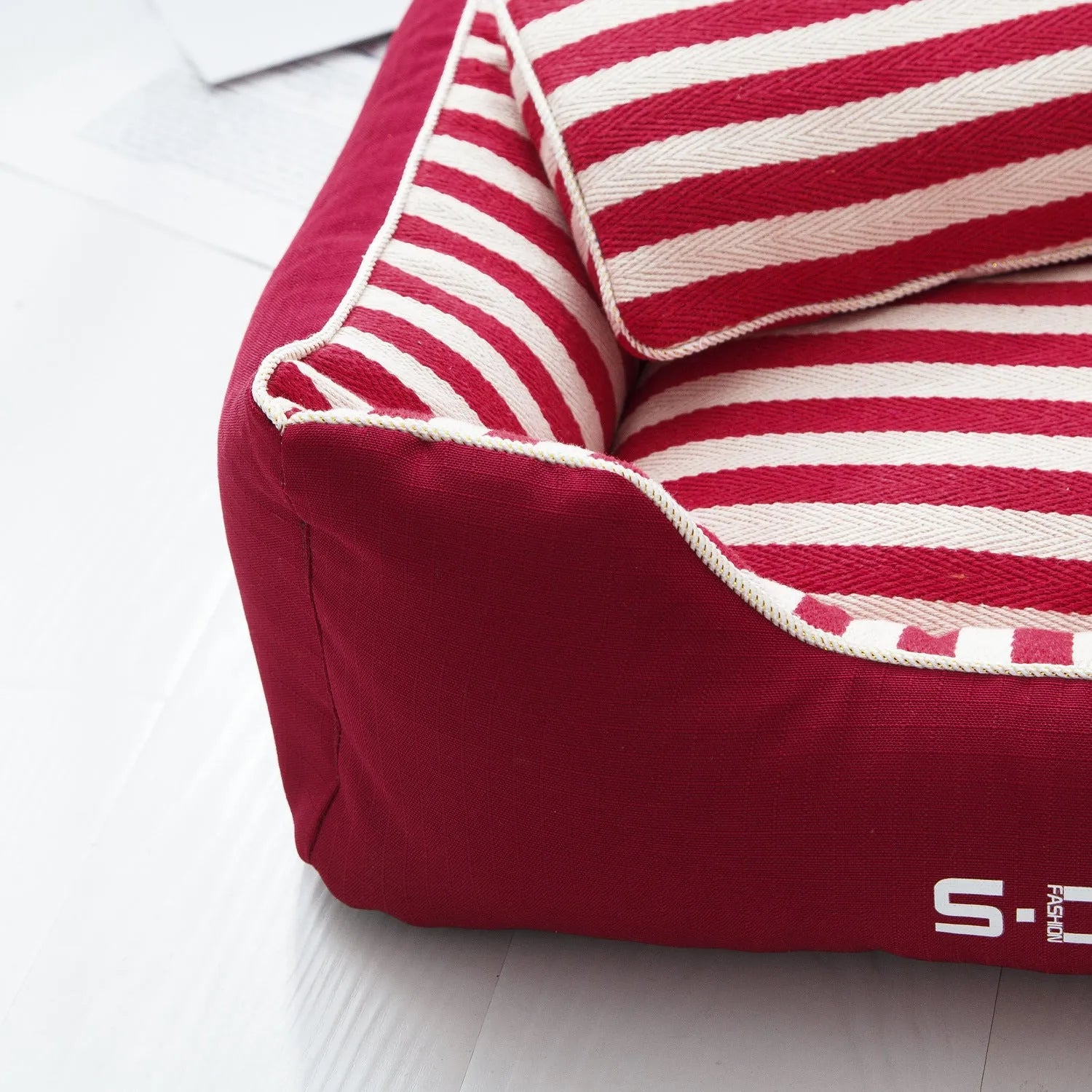 Navy striped washable dog kennel mat with a removable cover and a matching mini pillow.