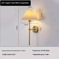 Retro LED wall lamp in iron finish with apricot colour option for bedside reading