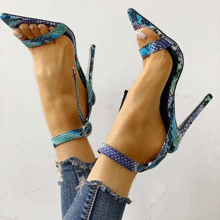 Blue women's high heel shoe with buckle closure, pointed toe, and hollow-out detail on artificial PU leather.