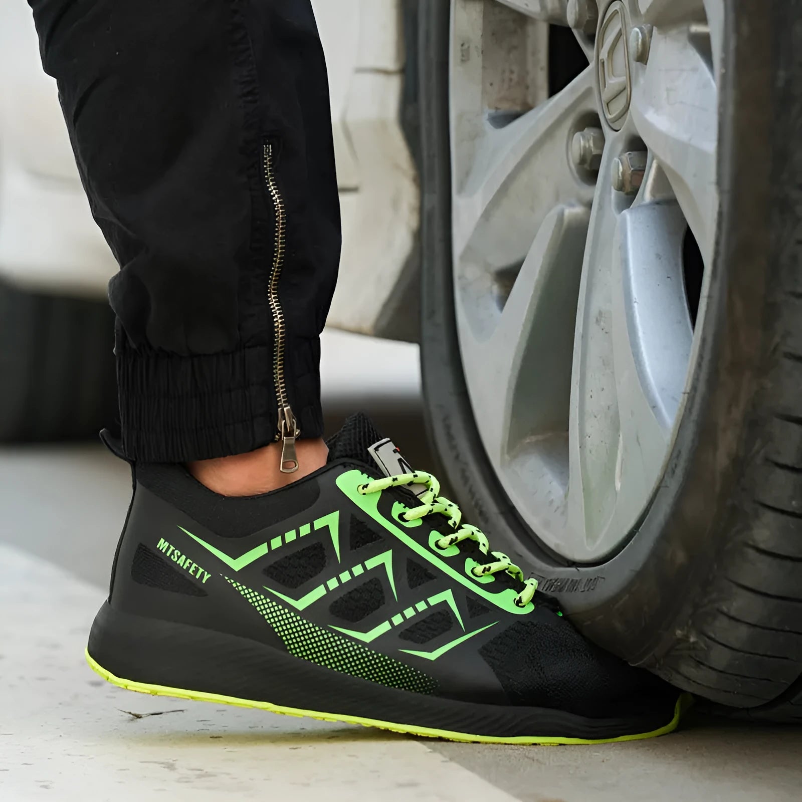 Black ultra-light safety work shoes with a steel toe cap and lace-up front.