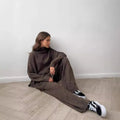 Women's dark grey acrylic knit suit set with side-slit sweater and trousers