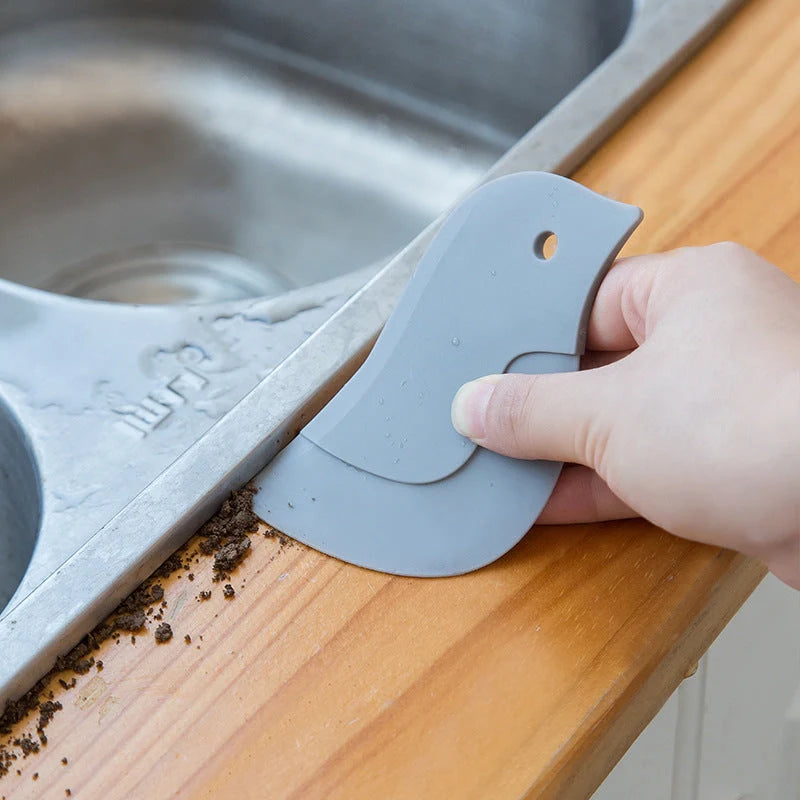 Penguin-shaped kitchen scraper for efficient plate and pot cleaning