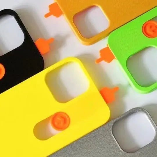 3D printed sliding middle finger phone case in bright yellow for iPhone 15 Pro Max with fall protection
