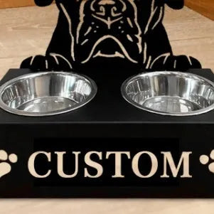 Personalised wrought iron dog bowl rack with custom name, 33x17x7cm, holding a metal dog bowl