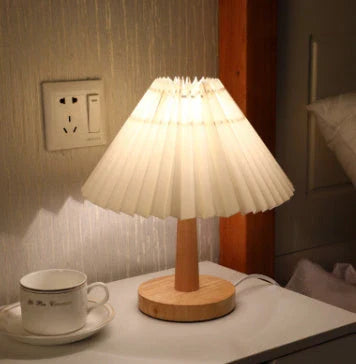 Versatile bedside lamp with dimmable LED light, bamboo base, and pleated fabric shade for New Zealand homes