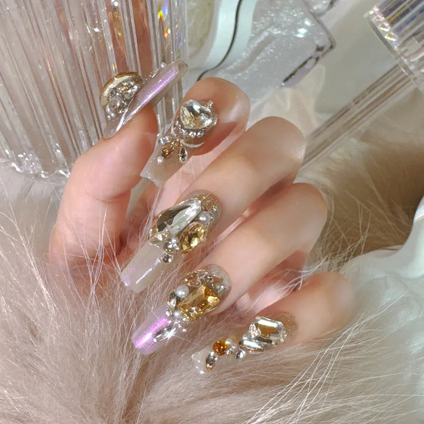 False nail patches with luxury rhinestone designs and phototherapy sealing layer on card packaging