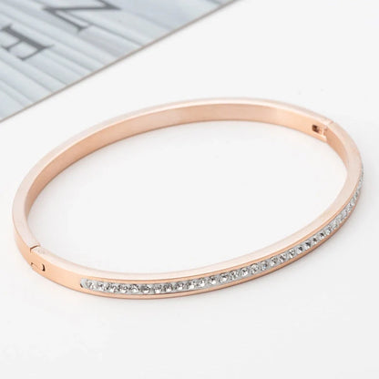 Single row stainless steel bracelet with diamond opening in gold, rose gold, or steel
