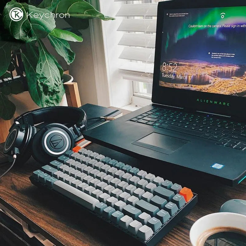 Grey 87-key mechanical keyboard with white backlight, USB and Bluetooth connectivity, compact plastic edge design