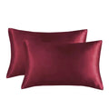 A pair of solid colour satin weave polyester pillowcases in one of thirteen available shades.