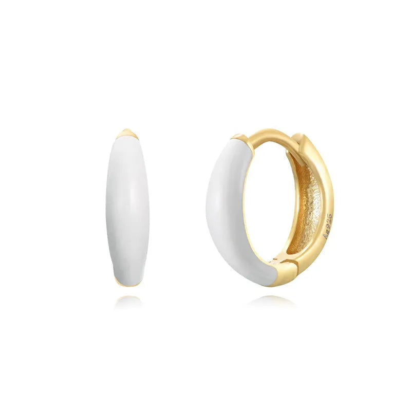 A pair of oval curved geometric epoxy earrings with a dripped oil finish in a choice of colours.