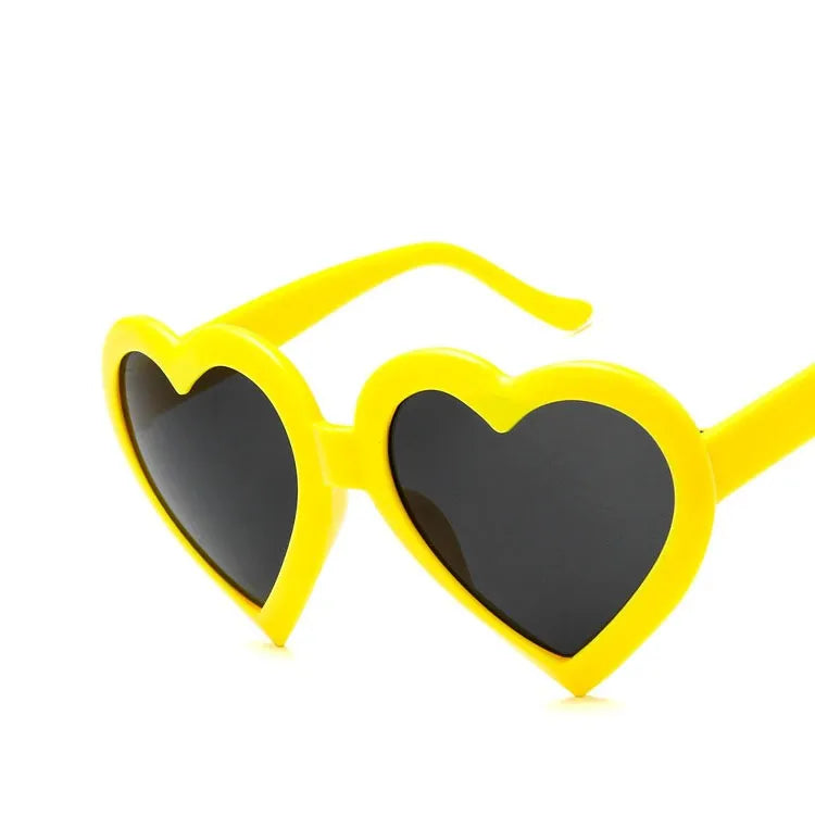 Children's heart-shaped sunglasses with bright red resin lenses and full rim frame