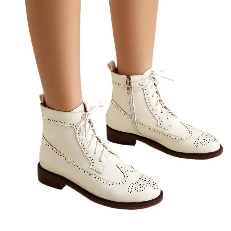 Women's chunky heel black classic boots with pointed toe, leather lining, and ethnic pattern