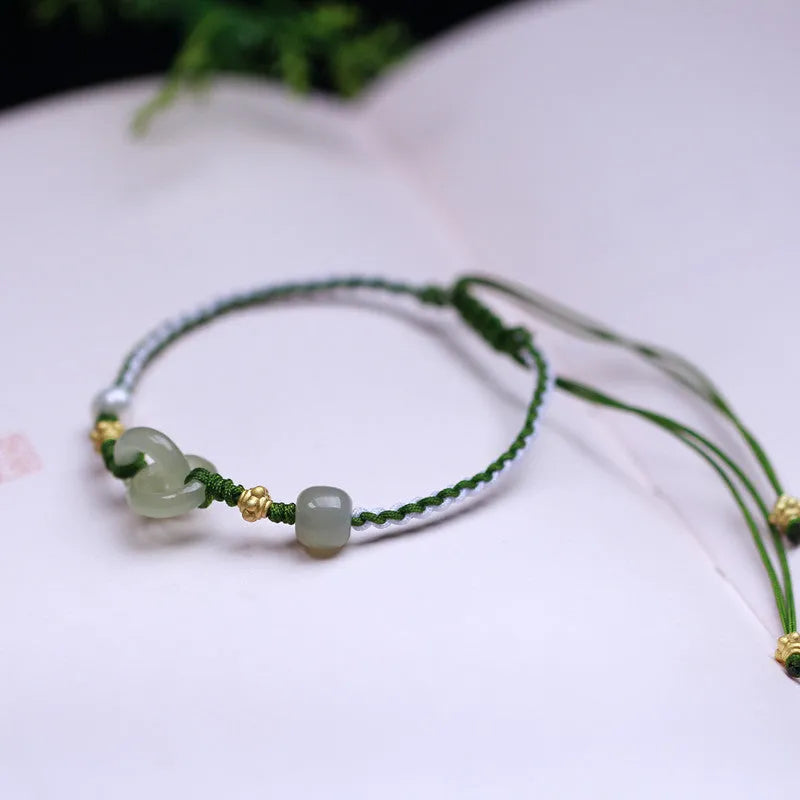 Natural Hetian jade woven bracelet with flexible wire construction and hollow out design