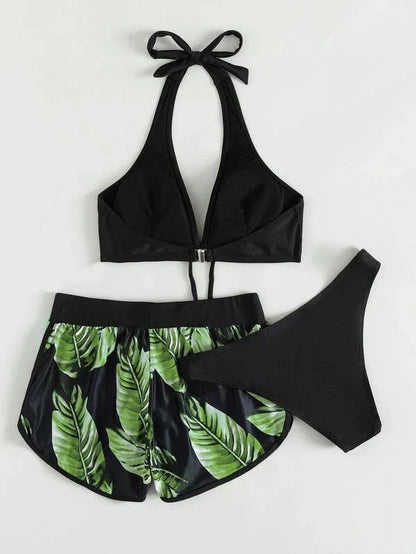 Chic leaf-patterned women's swimsuit set with bikini top, bottoms, and matching shorts in various vibrant colors