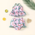 White polyester two-piece swimsuit set for girls with shirt top and shorts.