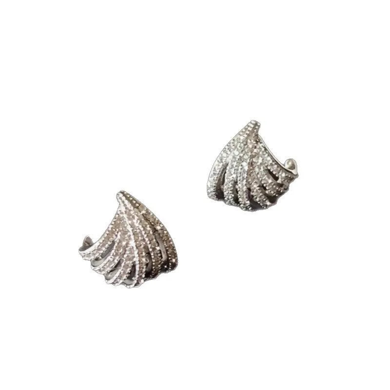 A pair of geometric drop earrings with a platinum electroplated finish on zircon.
