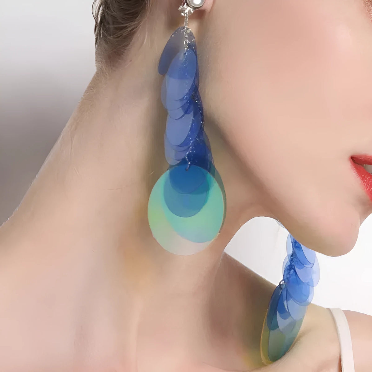 Gradient blue hand-woven long fringe earrings with artificial crystal and sterling silver needle on white background