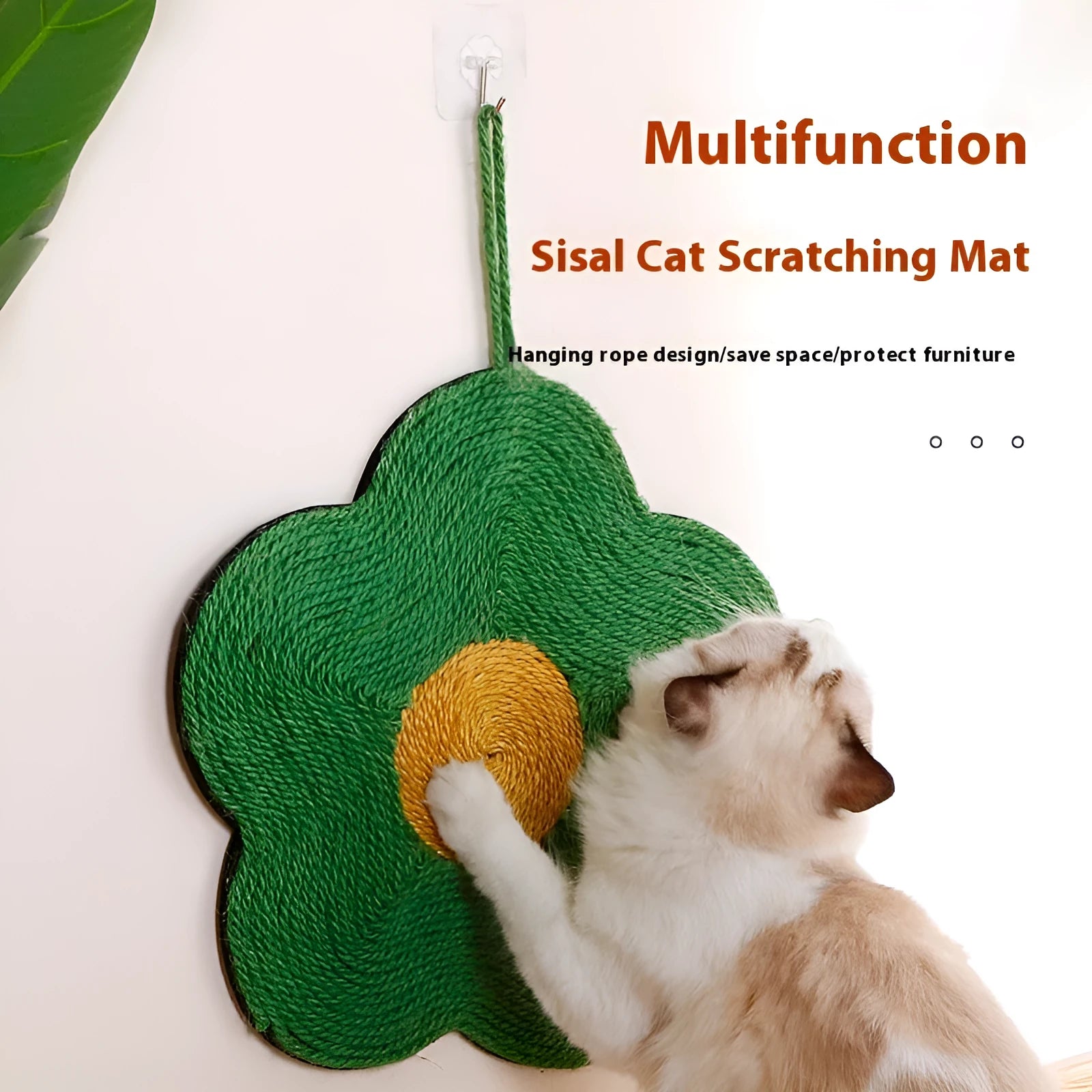 Green floral sisal cat scratching board on a wooden floor.