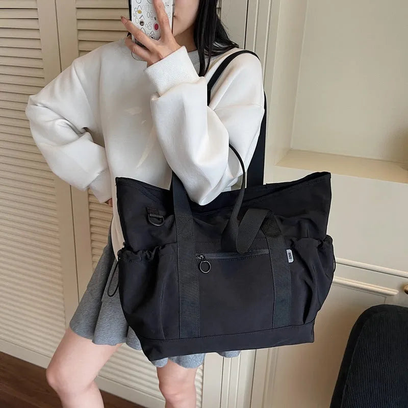 Women's lightweight grey yoga fitness travel bag with letter pattern and 36-55L capacity