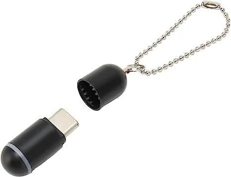 Black capsule-shaped infrared emitter for smartphone remote control.