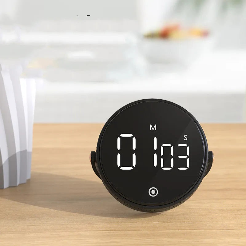 Black rotary digital timer with LED display showing 00:00, compact size