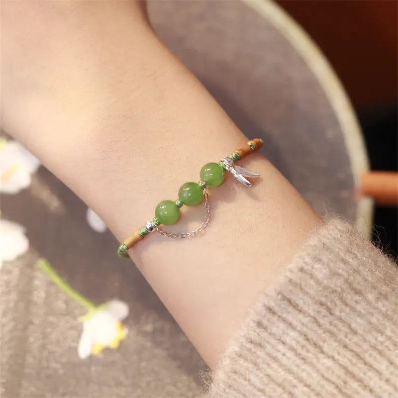 Women's Hetian jade bracelet with handmade woven carrying strap in light green or haze blue chalcedony.
