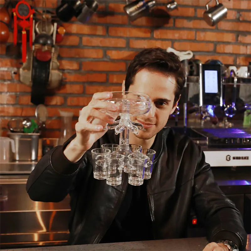 Clear six-shot glass dispenser rack holding six shot cups, bar accessory for parties.