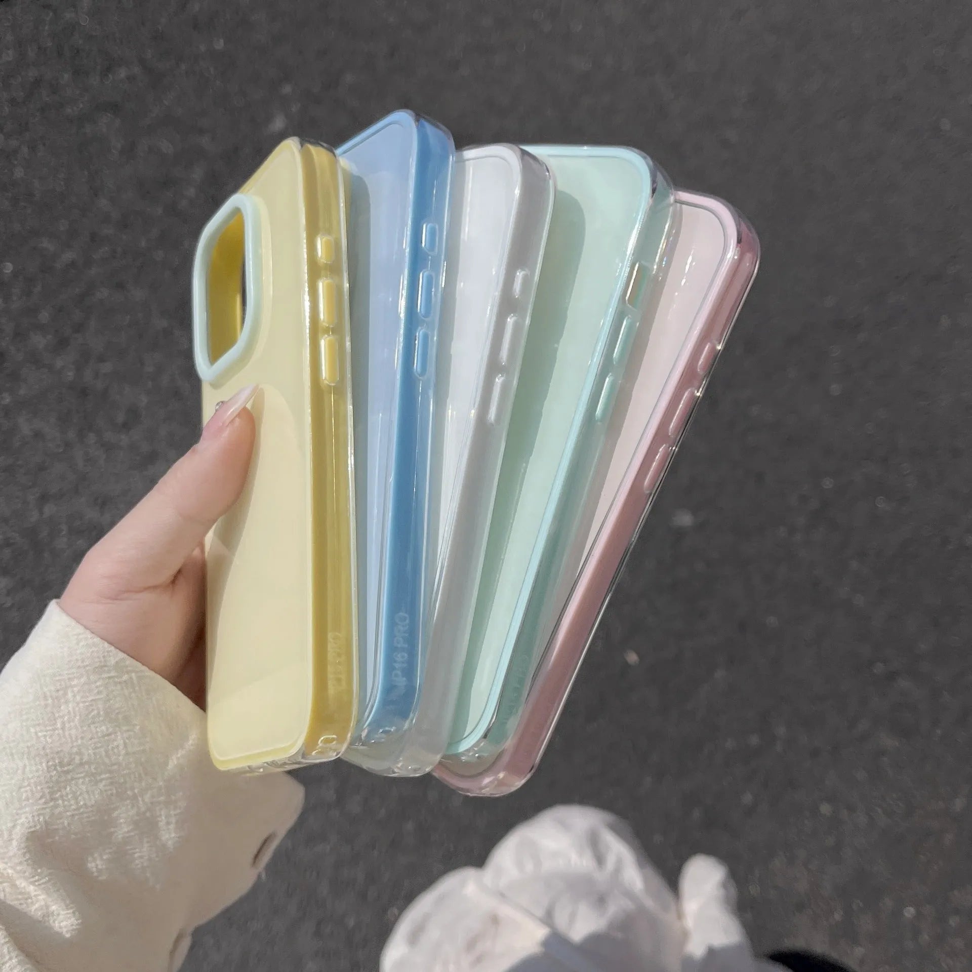Clear jelly iPhone phone case in solid blue colour on an iPhone, showing bumper-style all-inclusive protection.