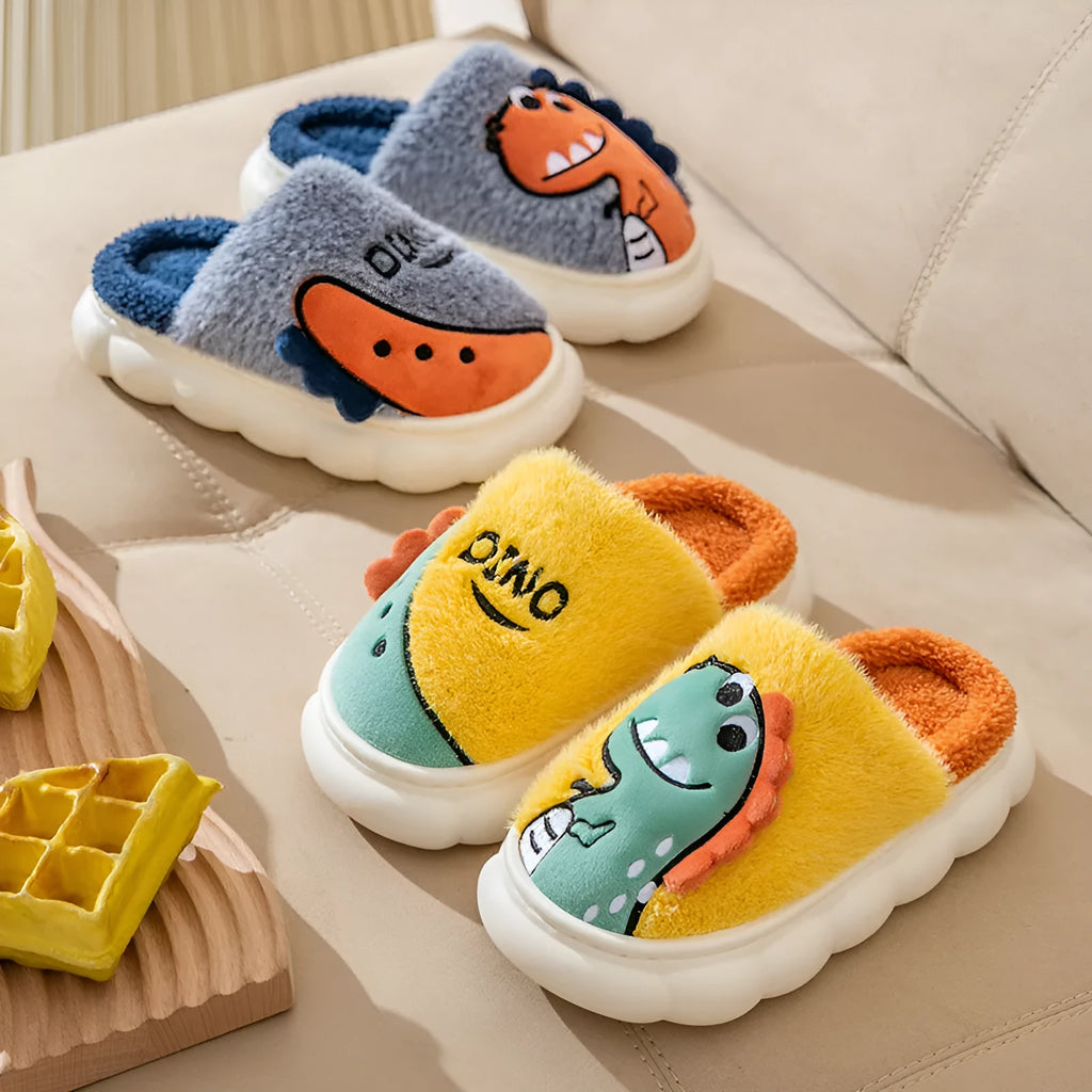 A pair of plush, thickened couple slippers in a dinosaur pattern, shown in grey, coffee, or orange yellow.