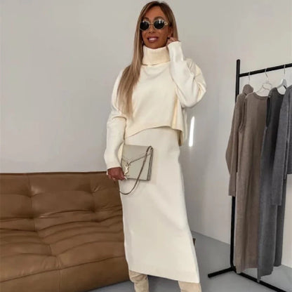 Women's winter fashion two-piece set featuring a turtleneck pullover and sleeveless long dress in white, grey, or camel.