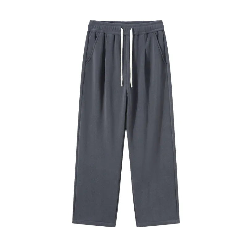 Men's double-sided polar fleece winter trousers in apricot colour showing loose Korean style and drawstring waist