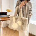 Soft plush tote bag with cartoon rabbit ears in one of six solid colours.