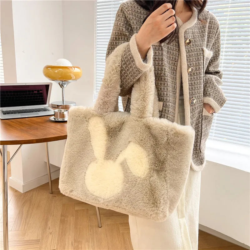 Soft plush tote bag with cartoon rabbit ears in one of six solid colours.