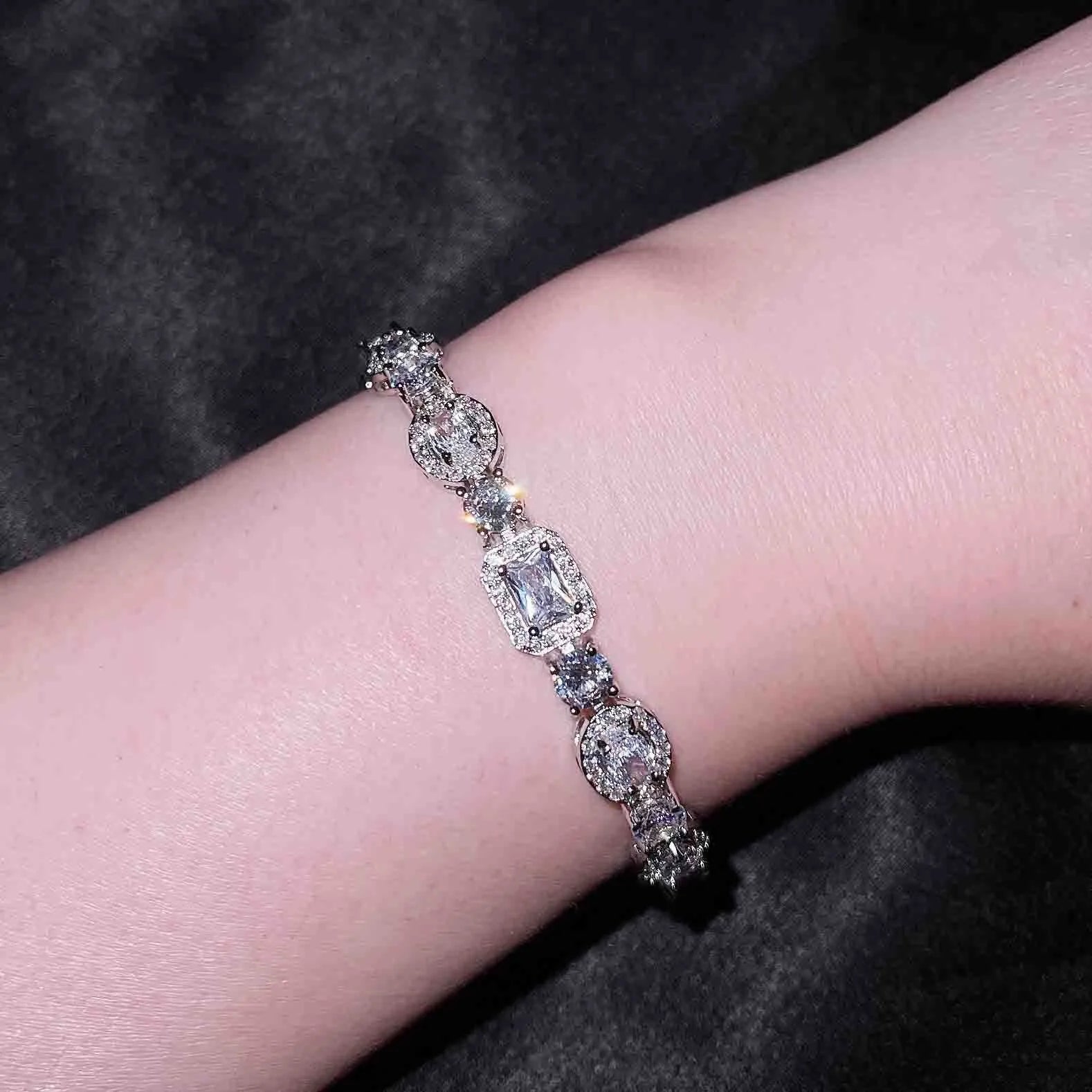 Women's silver-plated bracelet with sparkling zircon stones in a geometry shape.
