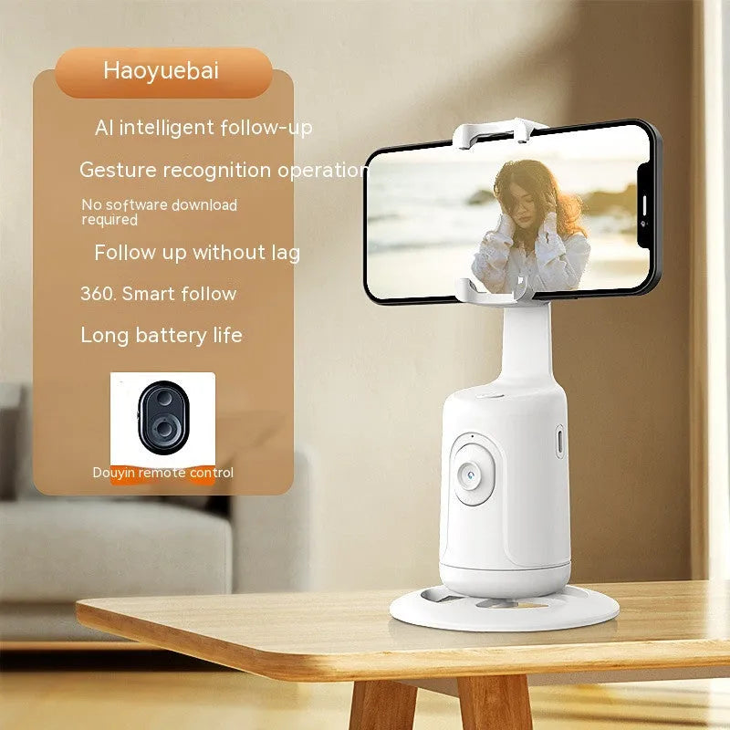 New automatic tracking stabiliser in dark black ABS plastic with 360-degree rotation on a desktop, USB cable attached