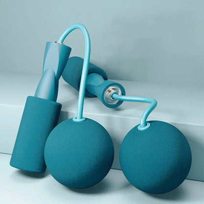 Weighted cordless jump rope with blue handles and PVC-coated steel rope for indoor fitness training