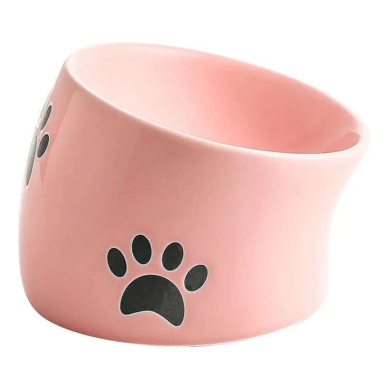 Ceramic cat bowl with slanted mouth design showing cat's paw pattern in yellow colour