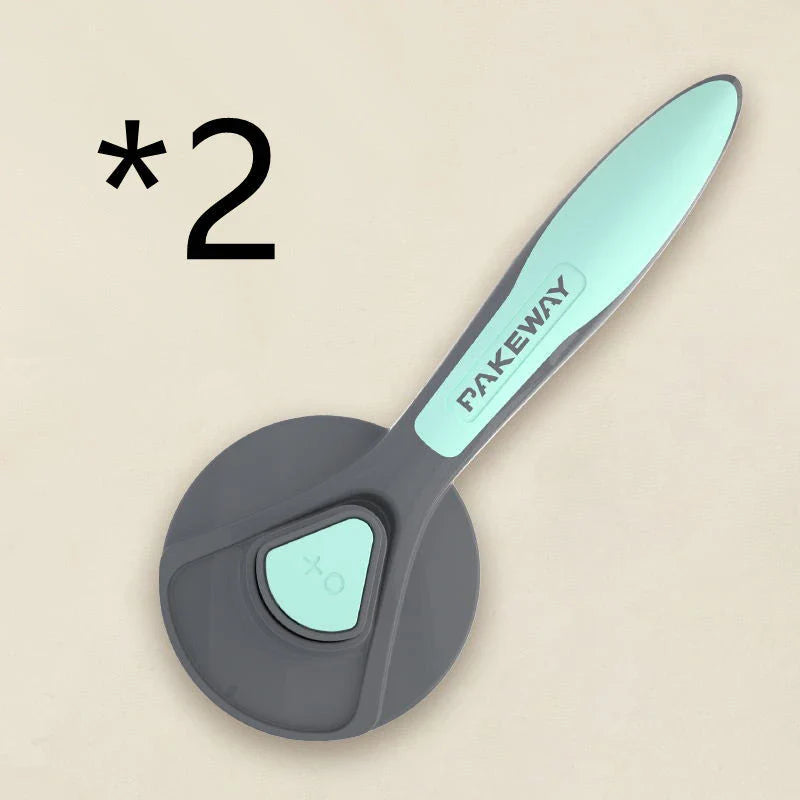 Ergonomic pet grooming brush in mint green, cherry blossom powder, and gentleman grey