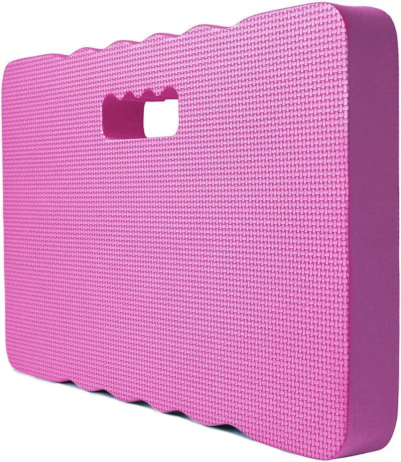 Blue EVA foam garden kneeler mat on grass, showing its rectangular shape and thickness.