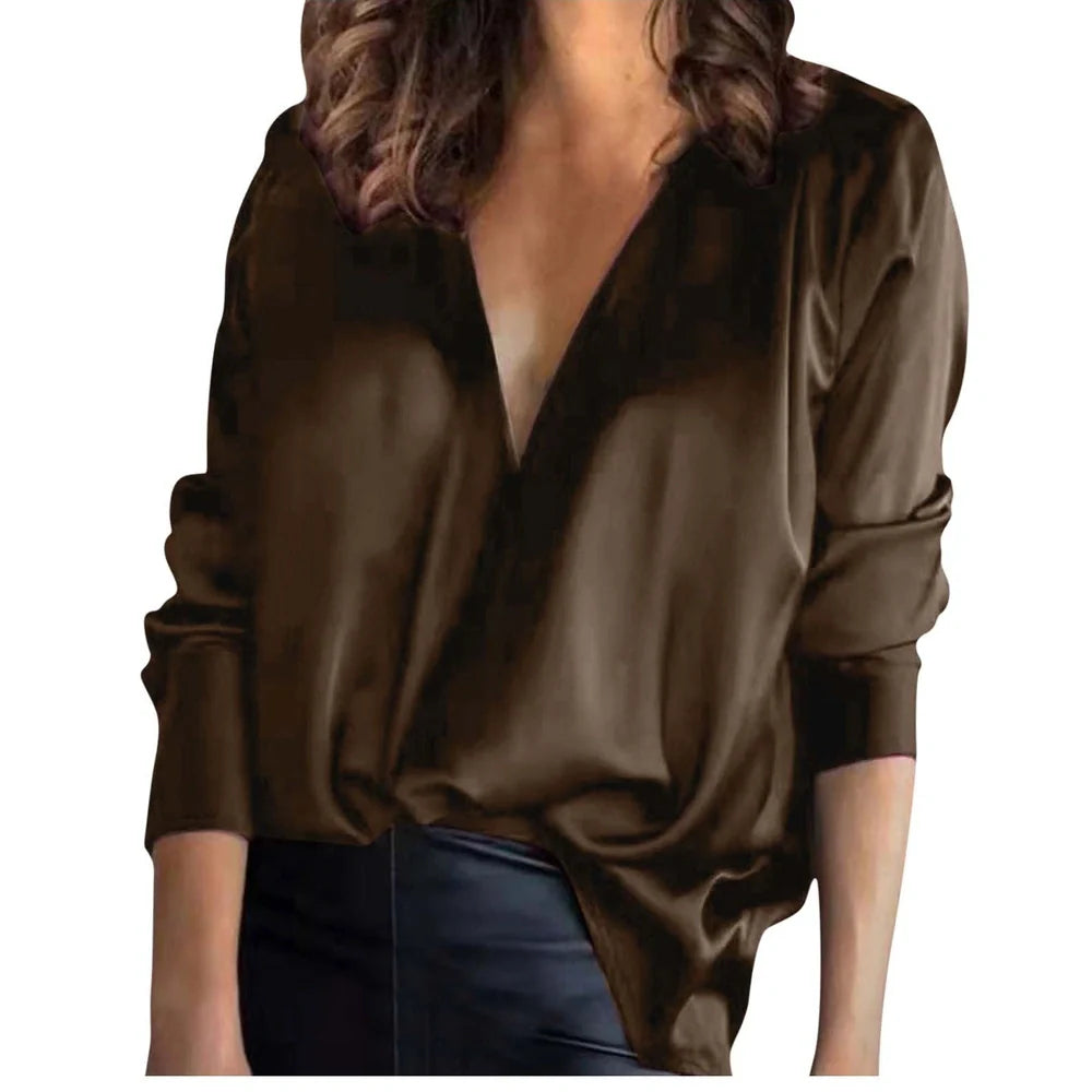Women's green satin long-sleeved shirt with nine-quarter sleeves on hanger