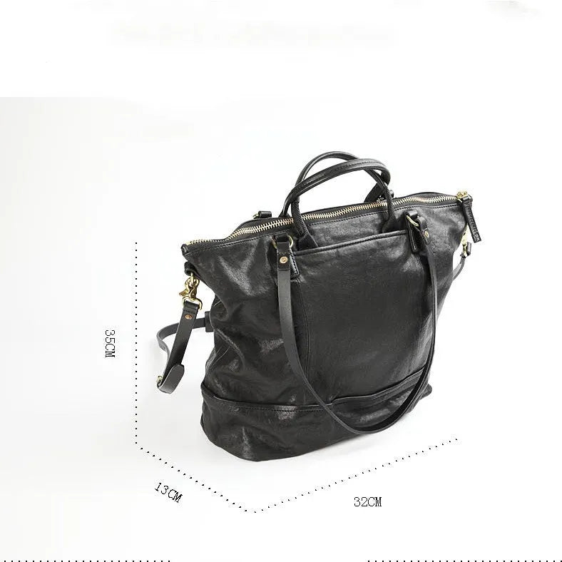Black handmade vegetable tanned cowhide tote bag with zipper closure and 15-inch computer slot for daily outdoor use