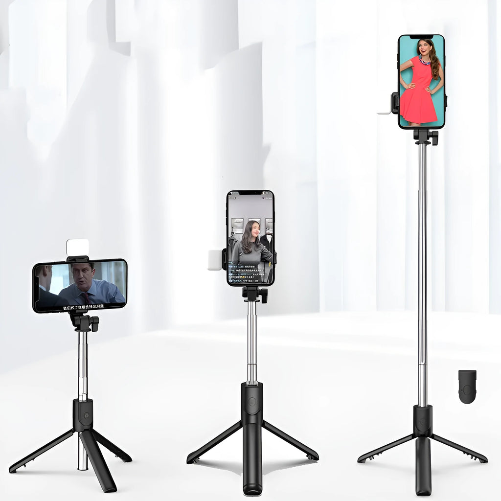 Black Bluetooth selfie stick tripod with fill light extended, holding a smartphone.