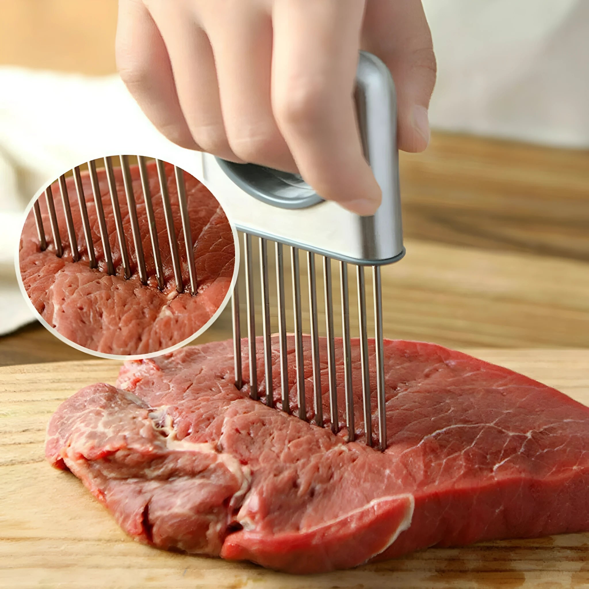 Stainless steel onion holder with sharp prongs and a finger guard on a kitchen counter.