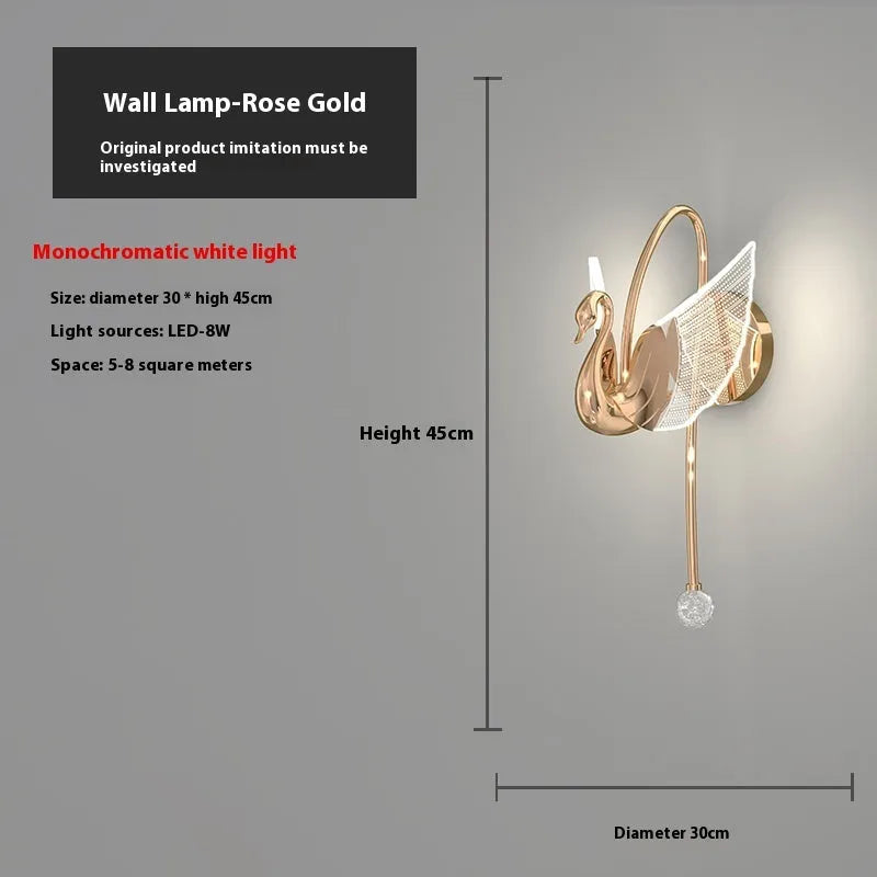 Modern minimalist gold swan-shaped wall lamp with an acrylic shade and LED light.