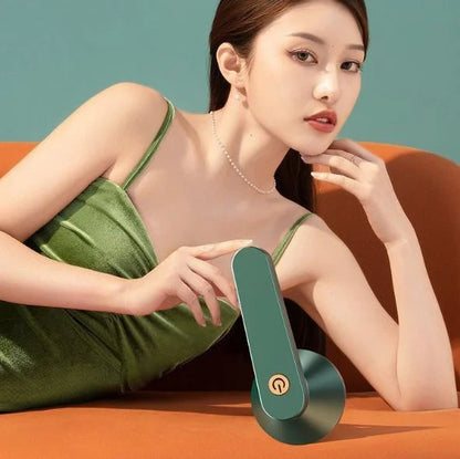 Green and white USB-powered fabric shaver device for removing pilling from clothing